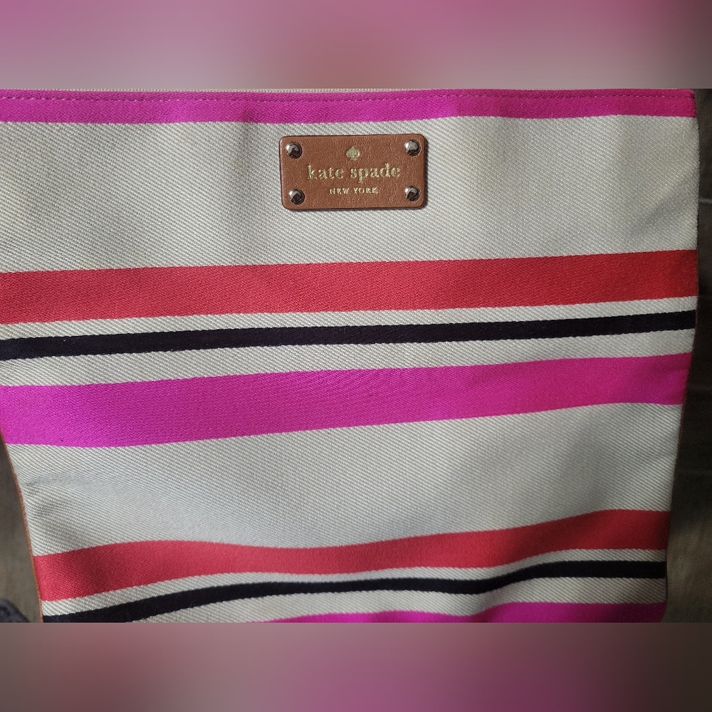 Kate spade NY Adrianne canvas striped flat pouch. Length-11. H-10in.